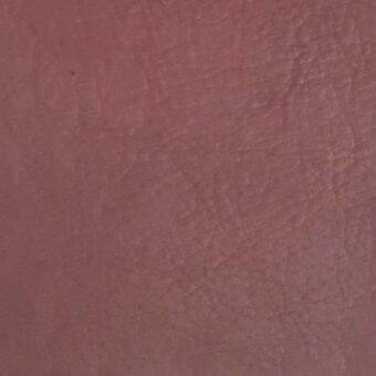 Rugiano leather swatch, dusty rose nabuk, with a matte finish and pebbled texture displaying natural grain and consistent color.